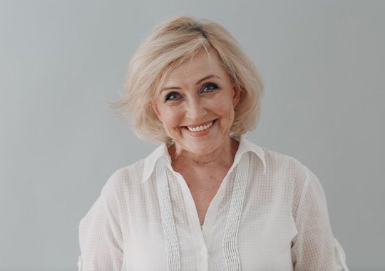 Lady in white shirt smiles