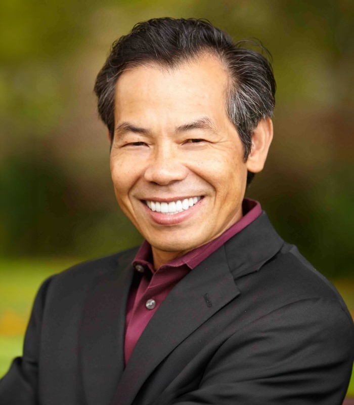 Owasso emergency dentist Doctor Heng Lim smiling