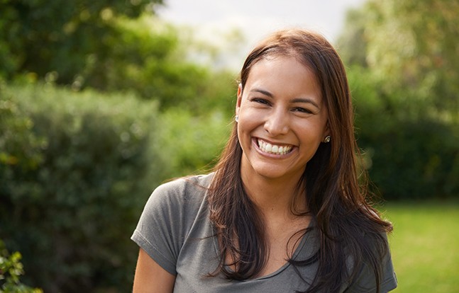 Happy, smiling woman in outdoor setting