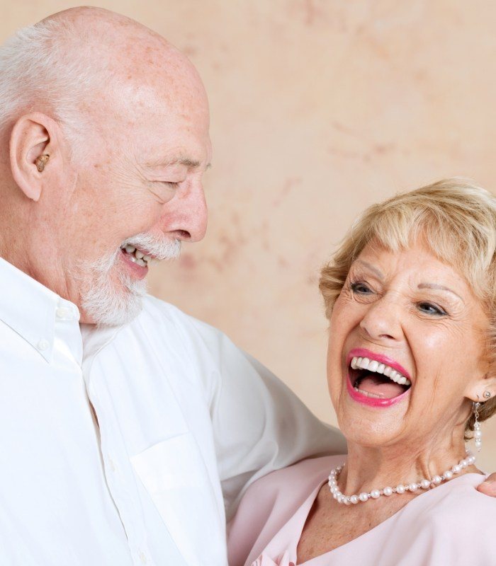 Senior man and woman laughing together