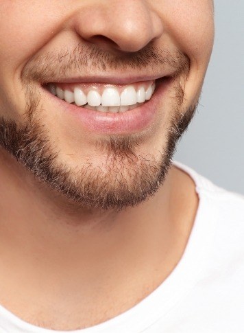 Close up of smiling man with short beard