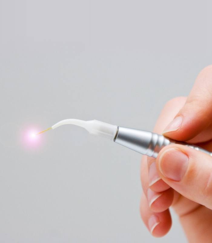 Hand holding metal dental laser technology