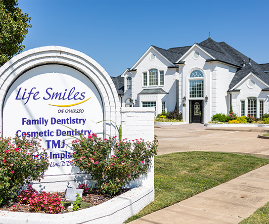 Life Smiles of Owasso sign outside of dental office building