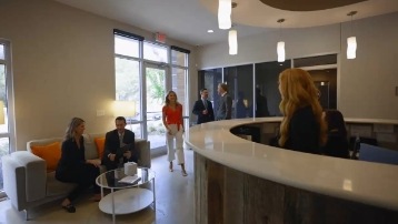 Several people walking through reception area at Life Smiles of Owasso