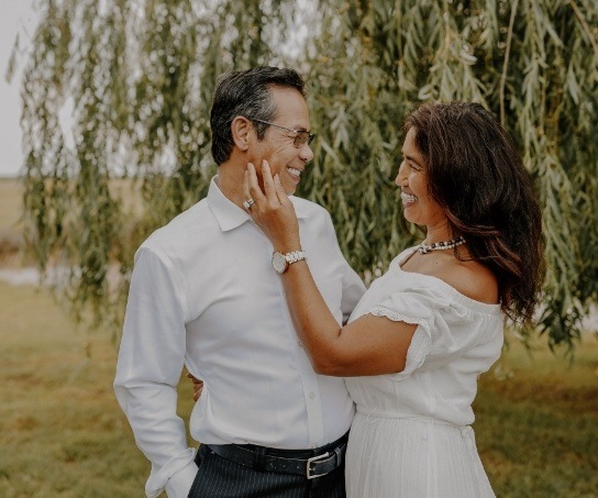 Doctor Lim and his wife smiling at each other