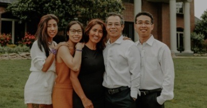 Doctor Lim smiling with his family