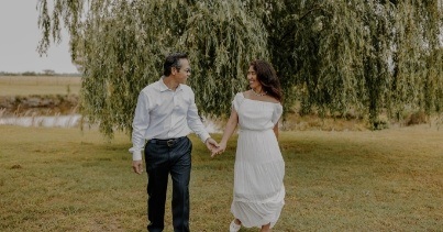 Doctor Lim holding hands with his wife outdoors