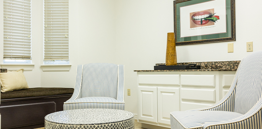 Two striped armchairs in reception area