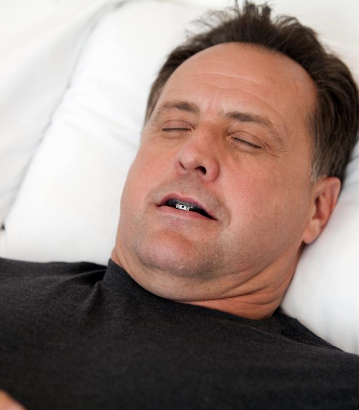 Sleeping man wearing an oral appliance