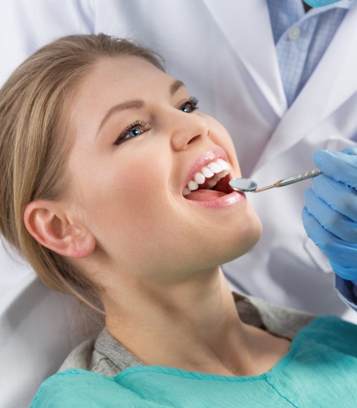 Woman receiving a preventive dentistry checkup in Owasso