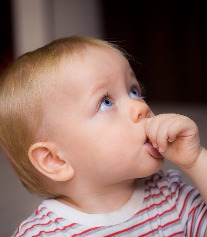 Baby sucking their thumb