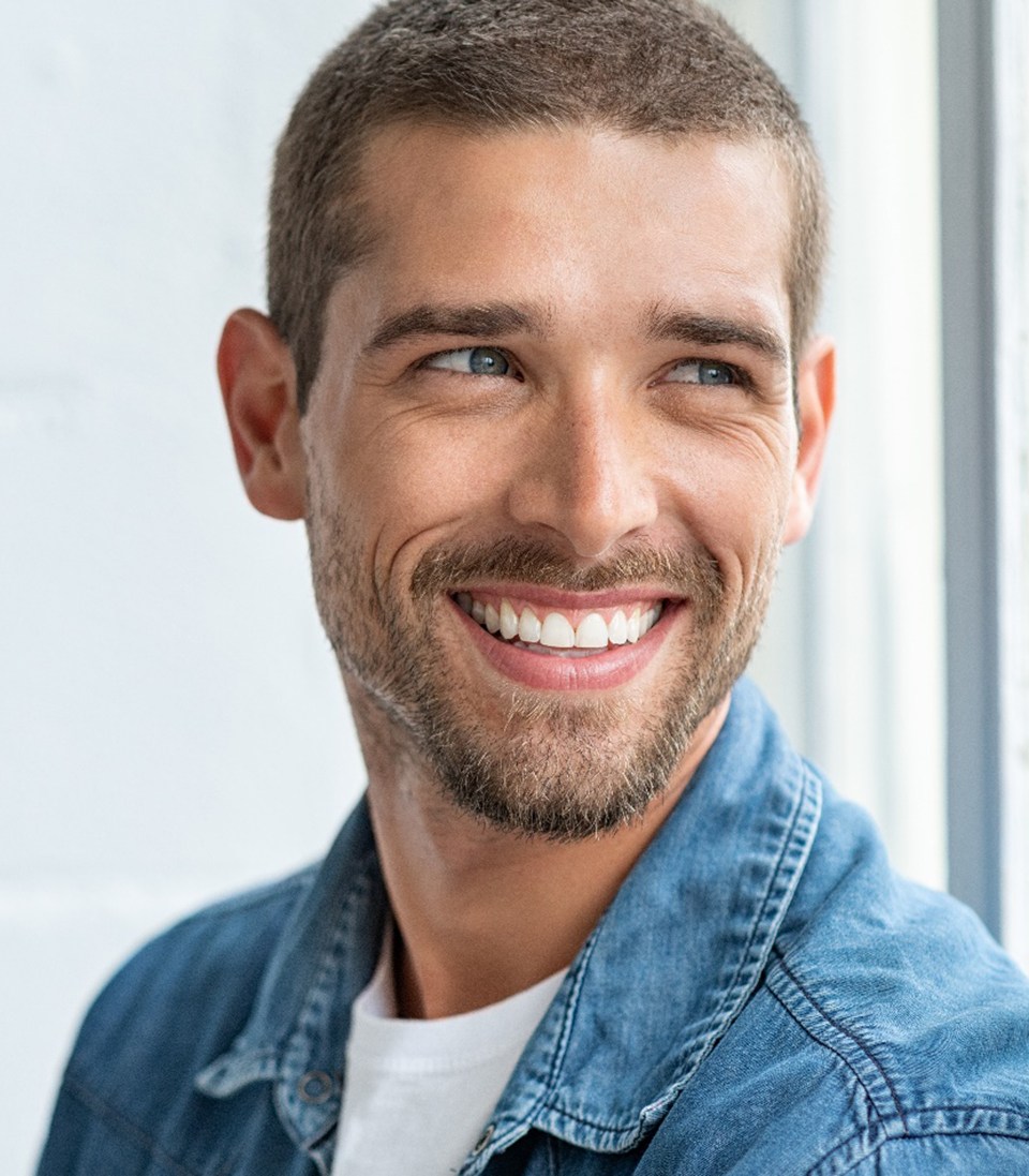 Man smiling and looking away
