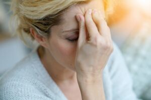 Woman suffering from headache. 